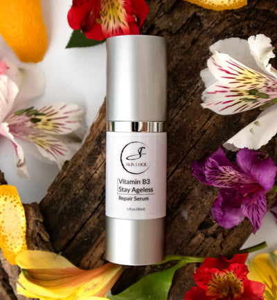 Vitamin B3 Serum in a bed of flowers